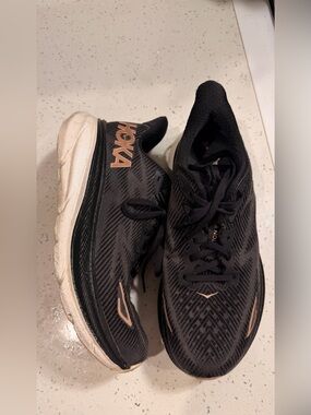 Hoka Black Sneakers with Metallic Pink Accents